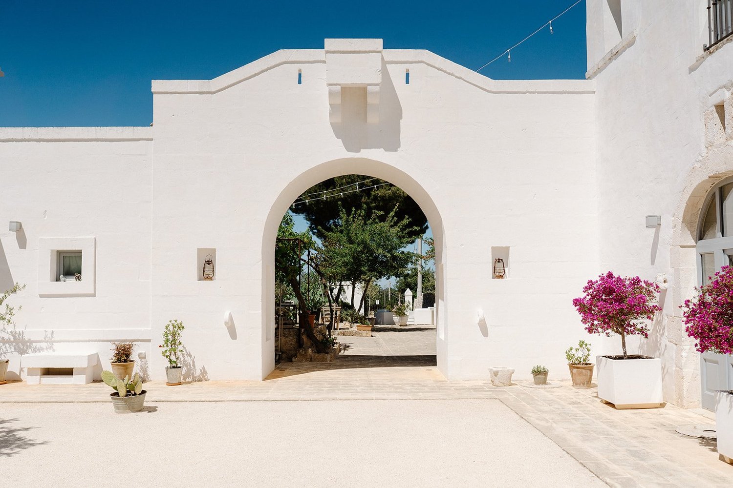 The whitewashed entrance arch of the masseria
